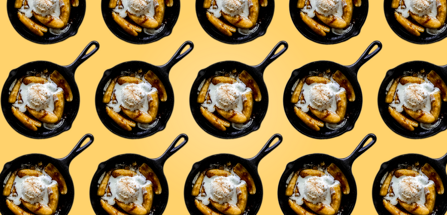 Bananas Foster desserts in cast iron skillet.